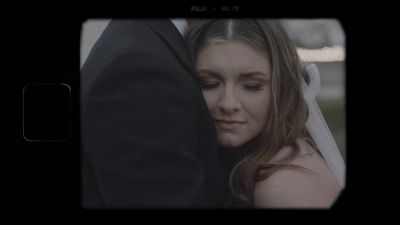 Tender moment between bride and groom, processed with vintage film grain