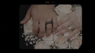 Hands and wedding rings on bouquet, vintage film frame