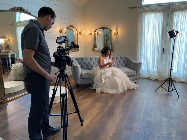 Wesley Blalock filming a bride in a bridal suite